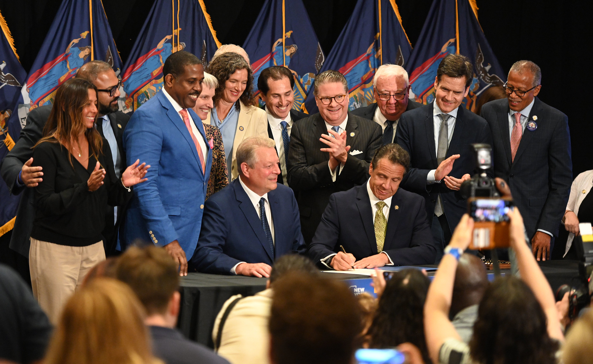 July 18, 2019--New York City--Governor Andrew M. Cuomo, joined by former Vice President Al Gore, executes the nation's largest offshore wind agreement and the single largest renewable energy procurement by any state in U.S. history - nearly 1,700 megawatts -with the selection of two offshore wind projects, that will create enough energy to power over 1 million homes, create more than 1,600 jobs, and result in $3.2 billion in economic activity.  Governor Cuomo also signed the Climate Leadership and Community Protection Act, or CLCPA, which adopts the most ambitious and comprehensive climate and clean energy legislation in the country. Today's announcement underscores New York's undisputed position as a global leader in climate and clean energy, and advances Governor Cuomo's nation-leading mandate of 9,000 megawatts by 2035.. (Kevin P. Coughlin/Office of Governor Andrew M. Cuomo)