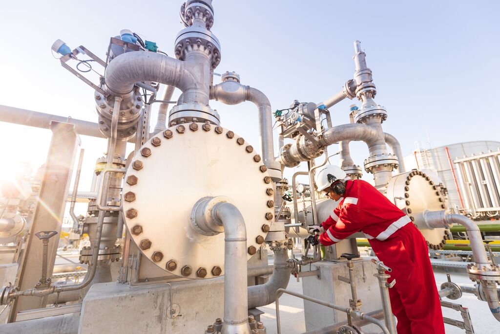 Shells liquefied natural gas (LNG) regasification terminal in Gibraltar 2018, switching from diesel-fuelled power generation to cleaner-burning natural gas.  It uses a newly commissioned 80-megawatt gas-fired power plant.  An inspector checks the gas pressure gauge of the evaporator.